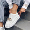 Baskets blanches femme en cuir avec chaîne décorative