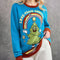 Maglione natalizio divertente – Maglione decorato con un motivo di albero di Natale in stile cartone animato, blu pavone