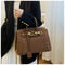 Bolso bandolera Kelly de ante con herrajes dorados