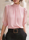 Blouse plissée à col montant