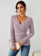 Top elegante da donna a maniche lunghe