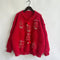 Maglione natalizio rosso da donna – Decorato con perline e arricchito da fiocchi